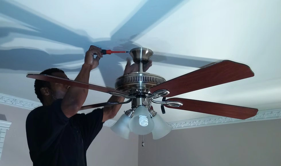 Licensed electrical contractor Phoenix service working on ceiling fan