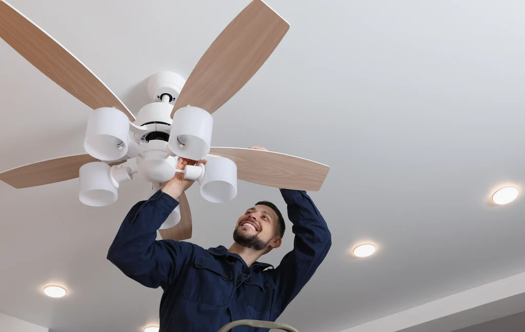 Licensed electrical contractor Phoenix service working on ceiling fan