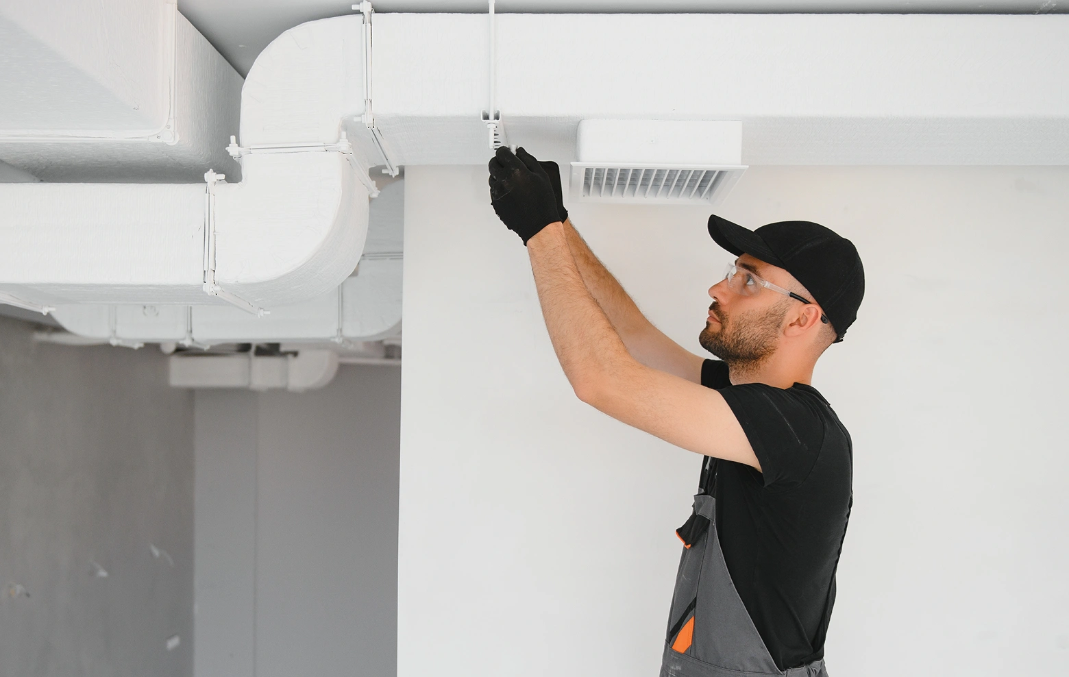 Trust Point AC residential Phoenix repairman working on ductwork
